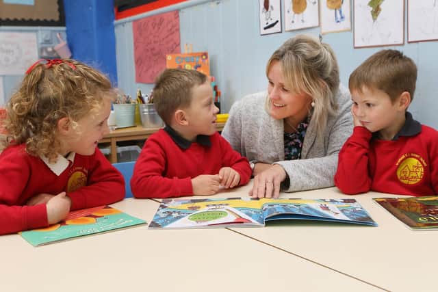 Head Becky Gordine with children in the reception class following the school's recent Ofsted inspection.
