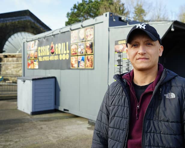Essie Grill owner Ismail Rammo in front of his grill shack outside Buxton train station. Photo Brian Eyre