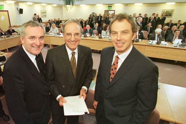 ​Bertie Ahern, Senator George Mitchell and Tony Blair after the signing of the agreement on April 10 1998