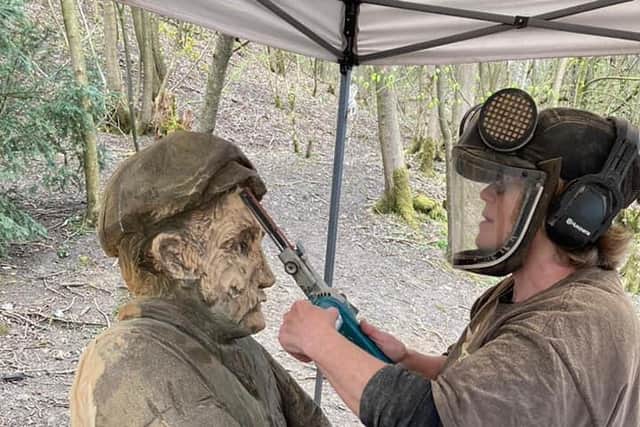 Jack the quarry worker given a quick makeover by sculptor Lorraine Botterill who will also be creating a female quarry worker next month.