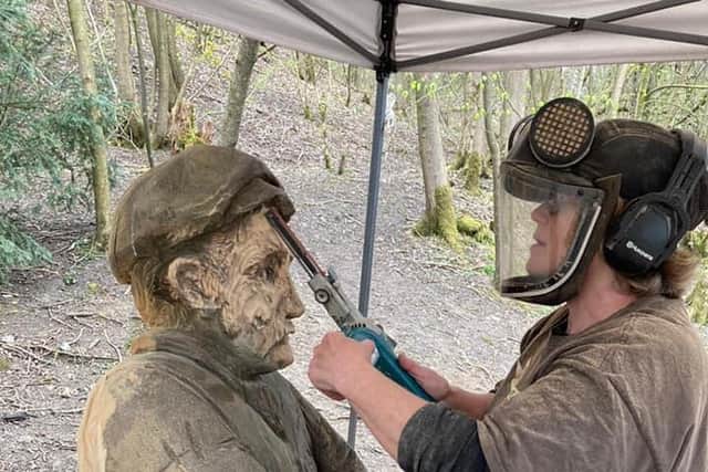 Jack the quarry worker given a quick makeover by sculptor Lorraine Botterill who will also be creating a female quarry worker next month.