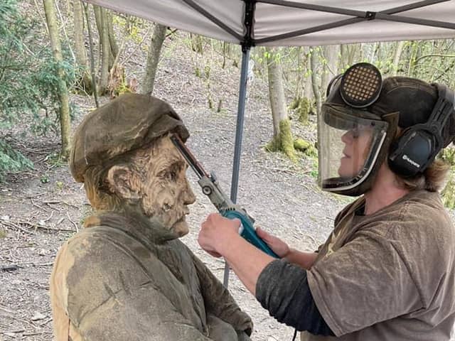 Jack the quarry worker given a quick makeover by sculptor Lorraine Botterill who will also be creating a female quarry worker next month.
