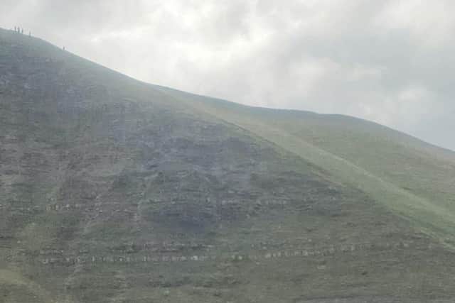 Two walkers were saved by emergency services after one fell and the other got stuck on Mam Tor.