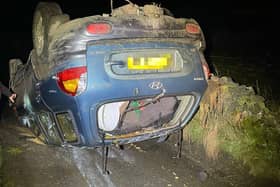 Police have launched an investigation after a car flipped onto its roof on a Derbyshire road.