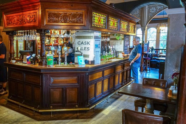 A customer ordering at drink at the Old Club House. Photo Brian Eyre
