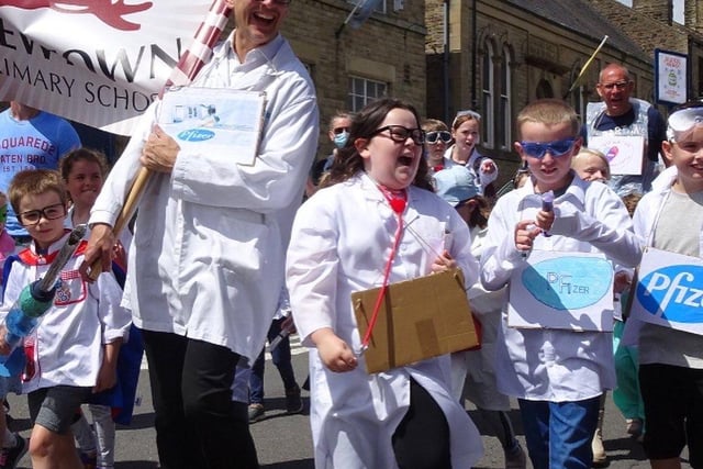 Children dressed up as the scientists behind the Covid-19 vaccination