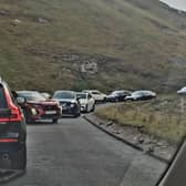 The scene in Winnats Pass over the weekend involving cars parked on the clearway. Image from Stuart Cox.