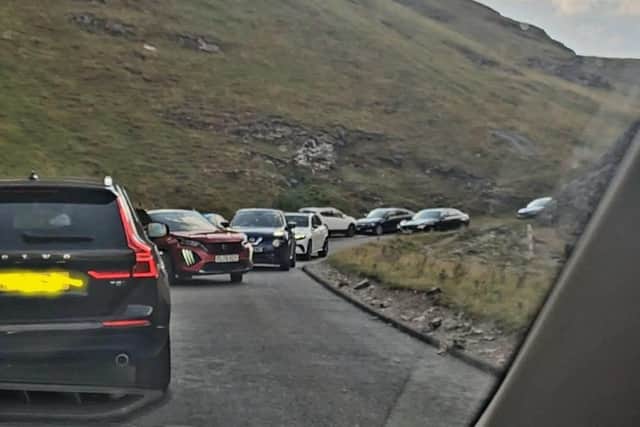 The scene in Winnats Pass over the weekend involving cars parked on the clearway. Image from Stuart Cox.