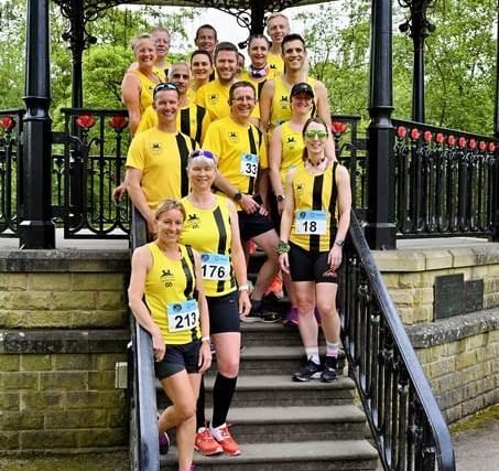 Big smiles as runners pose at the bandstand in Pavilion Gardens. Pic Bryan Dale