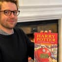 Jim Spencer, head of books at Hansons Auctioneers, with the pristine first-edition copy of Harry Potter and the Philosopher's Stone.