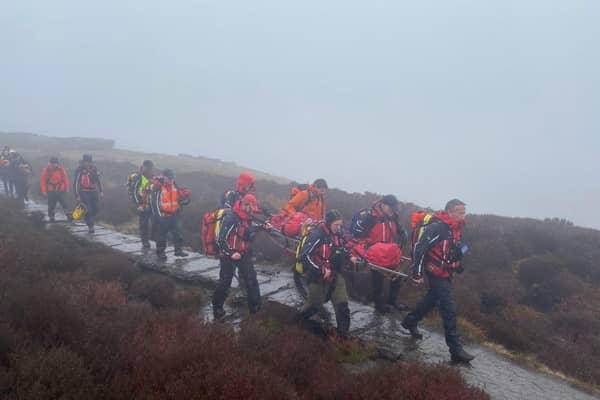A mountain rescue team has been called following reports of a woman stuck in deep mud in the Peak District on Easter Monday.