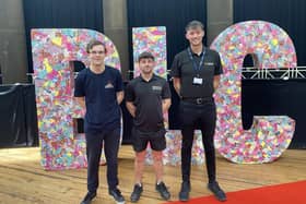 Aaron Woodward, Daniel Hallworth, and Eoin Jones standing in front of ‘BLC’ letters