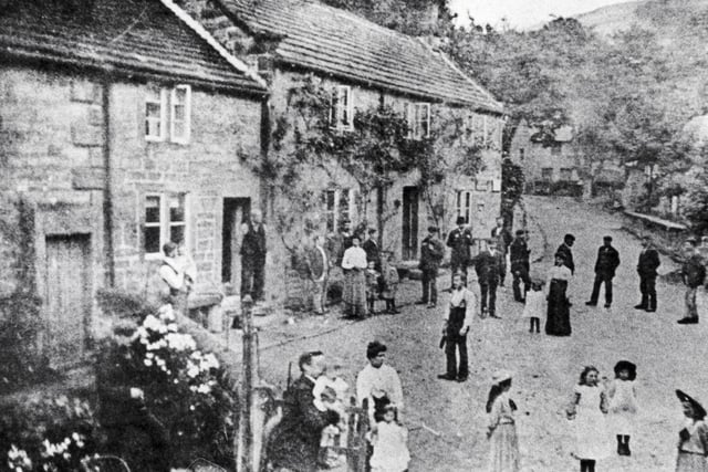 A busy day in Ashopton in 1912. Residents of the now submerged Ashopton village turned out for this photograph, many of them in their Sunday best