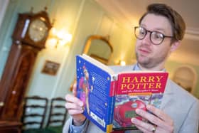 Jim Spencer at Hansons Auctioneers with the Harry Potter first edition.