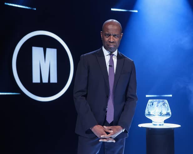 Clive Myrie with Mastermind Glass Bowl Trophy