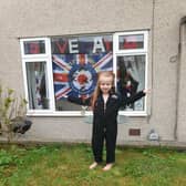 Aniyah-Grace, age four, is proud of her VE Day decorations.