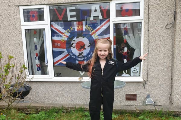 Aniyah-Grace, age four, is proud of her VE Day decorations.