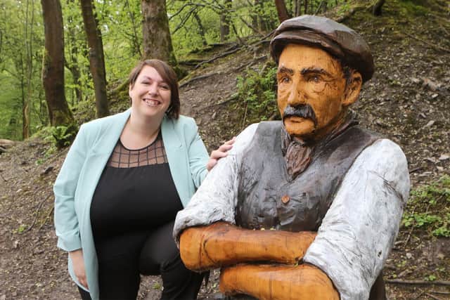 Buxton Advertiser Louise Cooper standing next to the Jack the Lime Worker statue in Grin Low Woods. The Advertiser has launched a campaign to raise the funds needed for a female quarry worker statue