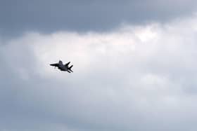 A US Air Force (USAF) F-15E Strike Eagle fighter jet, is pictured as it prepares to land at RAF (Royal Air Force) Lakenheath. The UK Coastguard launched a search and rescue operation Monday to find the pilot of a US fighter jet that crashed during a training mission in the North Sea. (Photo by CHRIS RADBURN / AFP)