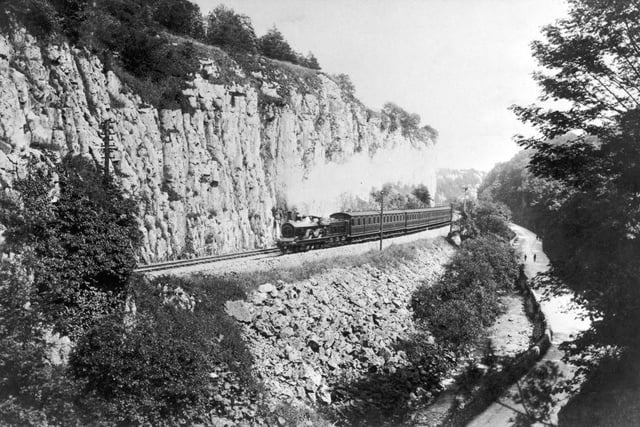 A steam train passes along the Buxton branch of the Midland Railway, circa 1910.