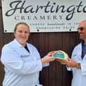 Adrian Fowler handing over his family's pride and joy to Hartington Creamer's head cheesemaker Diana Alcock. (Photo: Contributed)