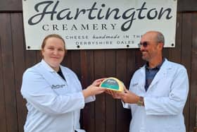 Adrian Fowler handing over his family's pride and joy to Hartington Creamer's head cheesemaker Diana Alcock. (Photo: Contributed)
