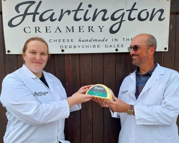 Adrian Fowler handing over his family's pride and joy to Hartington Creamer's head cheesemaker Diana Alcock. (Photo: Contributed)