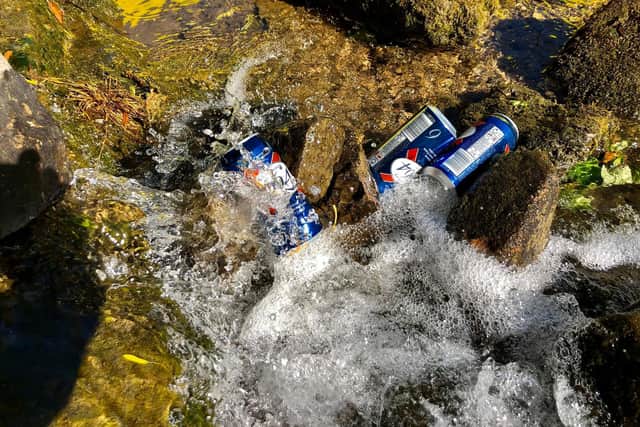 Paddle Peak posted this picture of beer cans dumped in a river.