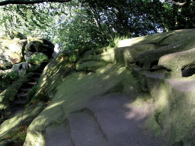 The Rowtor Rocks at Birchover have caves, rooms, tunnels, steps and even an armchair carved into the stone. Victorian tourists were lead to believe these were the work of an ancient Druid community - but were carved by a local man some 300 years ago.