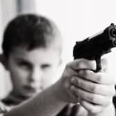 There is no minimum age to hold a shotgun certificate in England and Wales, but a child must be over 14 to have a firearm certificate.