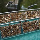 Thousands of padlocks known as 'love locks' adorn Weir Bridge across the River Wye in Bakewell. (Photo: Christopher Furlong/Getty Images)
