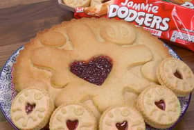 The giant Jammie Dodger - and how it sizes up to the shop-bought biscuit. Picture: B&M.