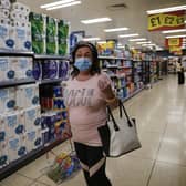 Face coverings are now mandatory inside shops in England (pic: Hollie Adams/Getty Images)
