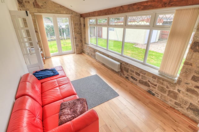 The dining room is adjacent to the lounge and has French doors opening onto the rear garden.