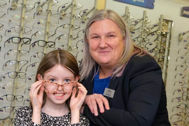 Left to right - Scarlett Devlin, age 8, and Melanie Page, Scrivens Chapel En Le Frith Branch Manager.