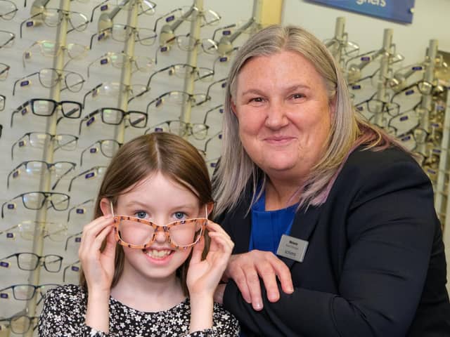 Left to right - Scarlett Devlin, age 8, and Melanie Page, Scrivens Chapel En Le Frith Branch Manager.