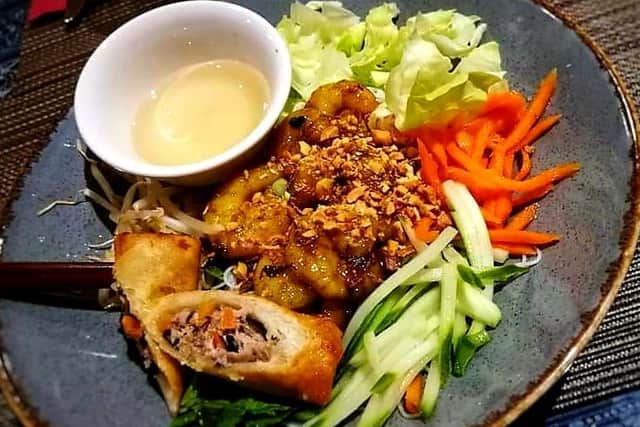 Bun Hoi - rice noodle salad with lemongrass chicken, fresh vegetables, peanuts and sweet fish sauce dressing