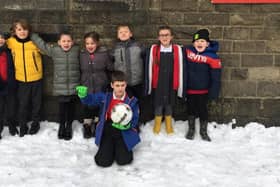 Some of the pupils at Buxton Infant School who are excited about the upcoming match at Silverlands - some students have even been selected to be mascots on the day.