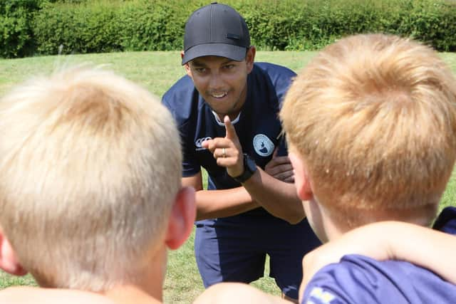 Coach Danny Deveny with the boys. Pic Jason Chadwick