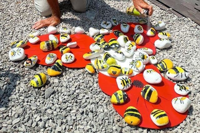 Painted bee pebbles brighten up Buxton Garden Trail