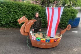 Oliver Lukasik with the Viking longboat he built for his school project