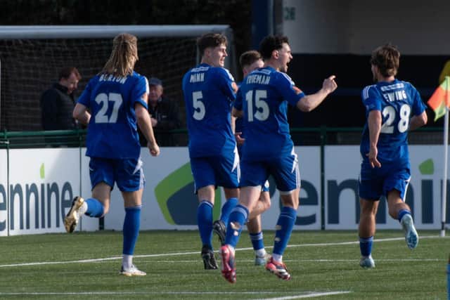 Ethan Mann celebrates with his team-mates. Photo: Phil Peat.