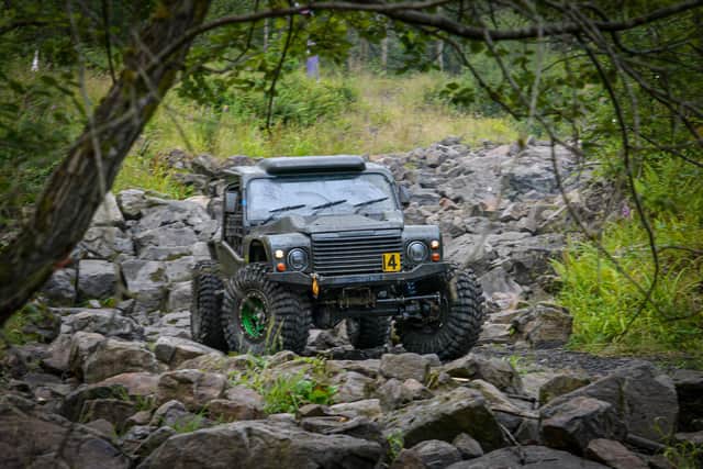 Harvey and Alex in action in their off-road vehicle.