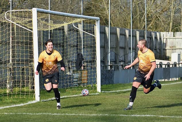 Harry Dean celebrates his goal with Chad Whyte. Photo by John Fryer.