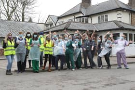 The vaccination team and some of the many volunteers celebrating reaching the 10,000 mark at Buxton's vaccination centre