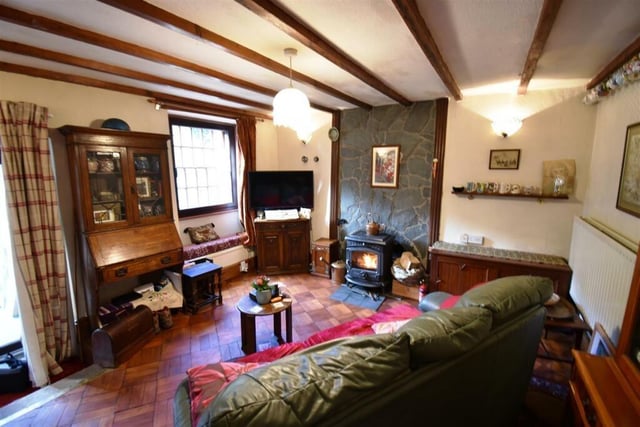 Exposed wooden ceiling beams add to the charm of this room.