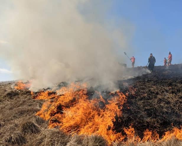 Firefighters tackling a large moorland fire at Rushup Edge on April 3.