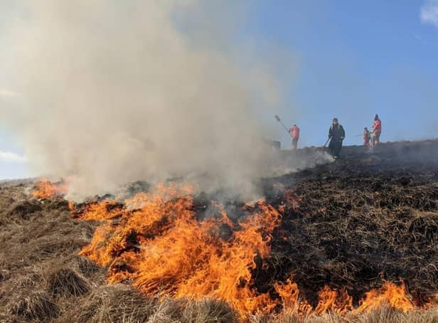 Firefighters tackling a large moorland fire at Rushup Edge on April 3.