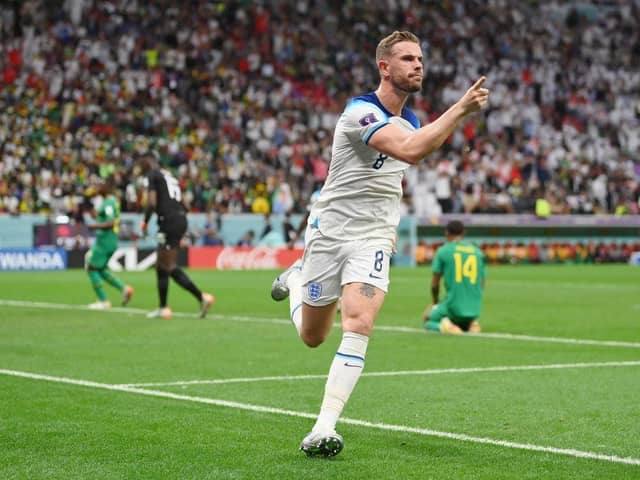 Jordan Henderson of England celebrates after scoring the team's first goal against Senegal at the Al Bayt Stadium. (Photo by Dan Mullan/Getty Images)