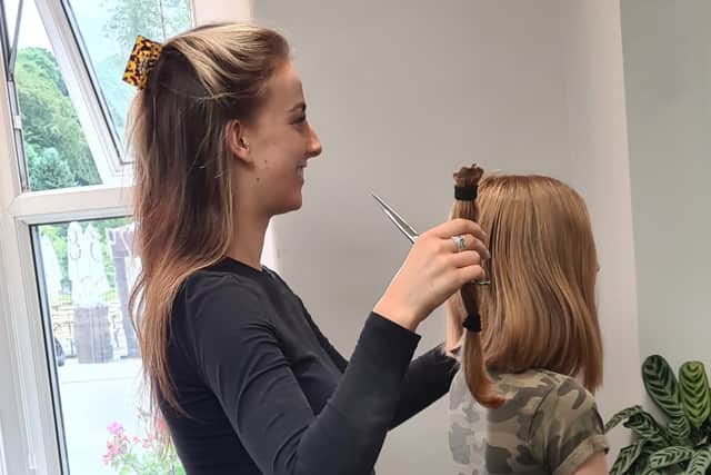 The moment of truth at Profile salon when a stylist removed 32 centimetres of Molly-Rose's hair.